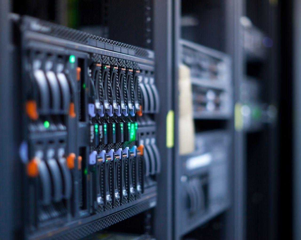 A close up of a server rack showcasing virtual hosting in a data center.