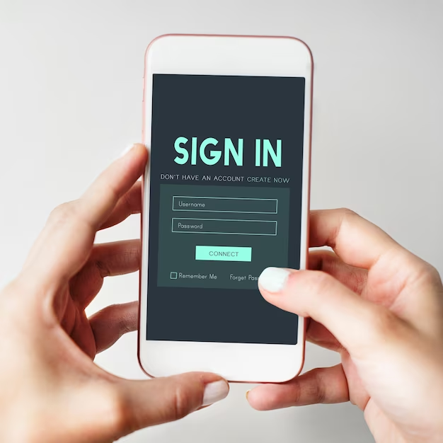 Hands holding a smartphone on which the email login screen