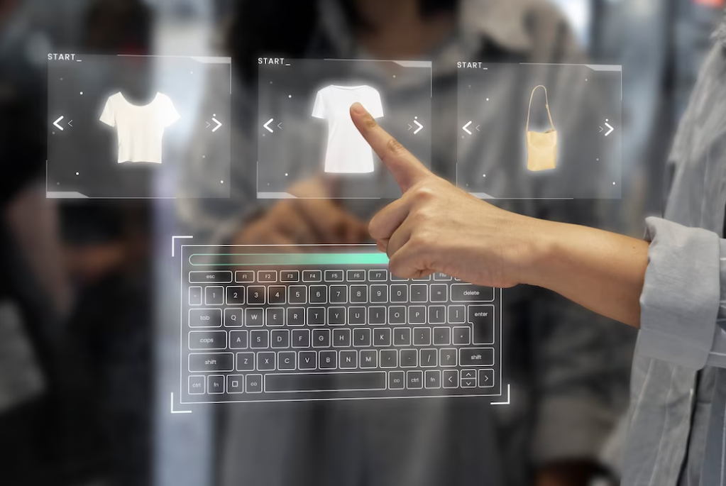 woman standing in front of a digital transparent screen with keyboard and clothes on it