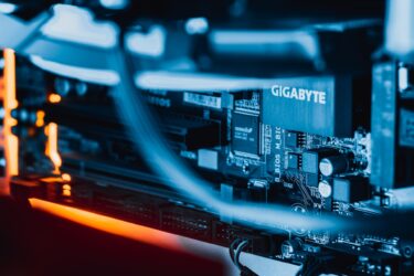 A close up image of a computer motherboard showcasing virtualization technologies.