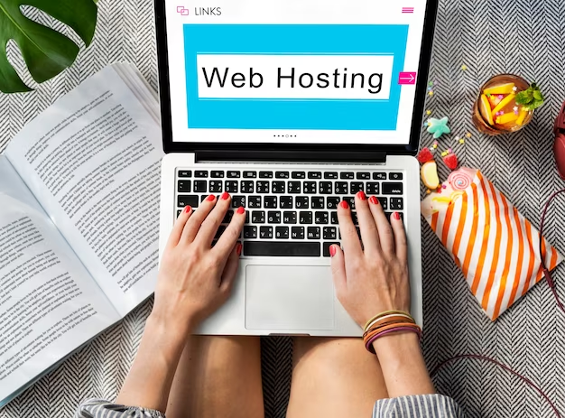 Female hands on a laptop with the inscription web hosting
