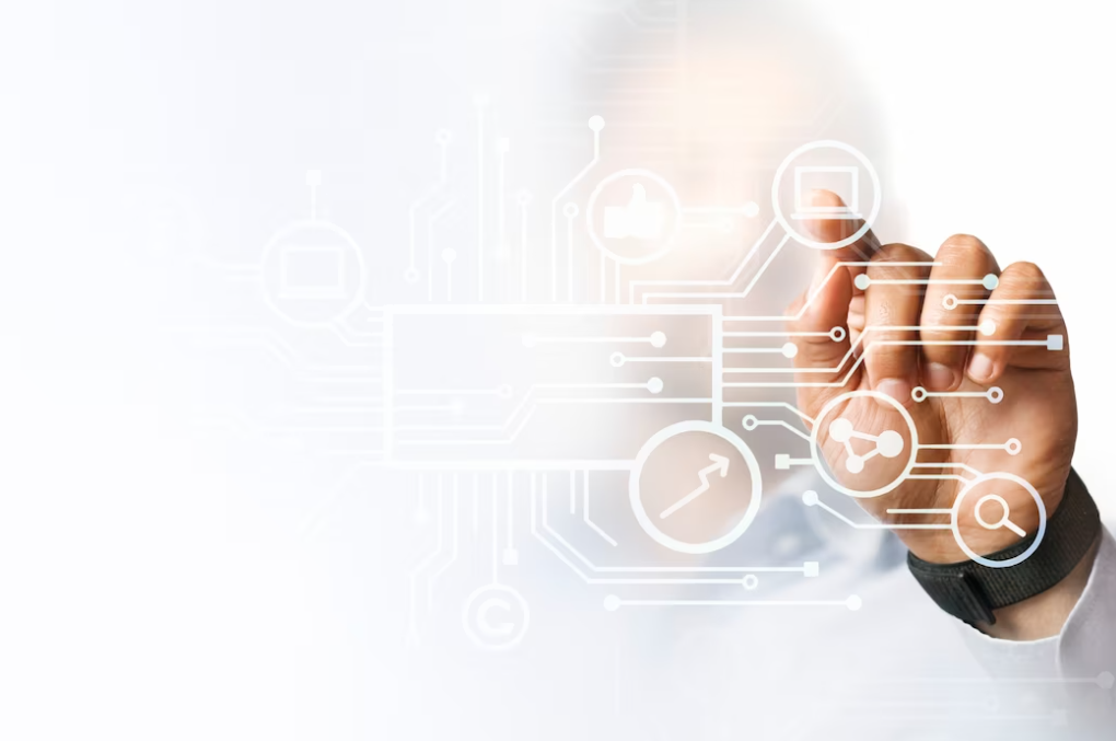 man in white shirt pointing at his presentation on the digital screen with icons on it